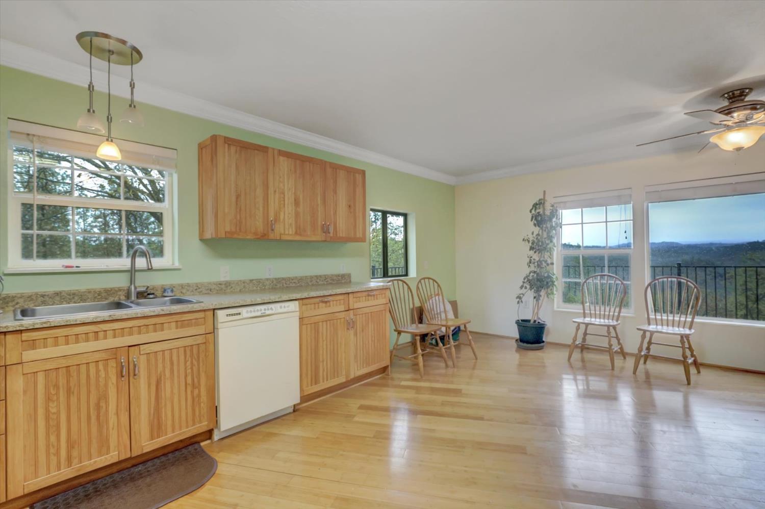 19121 Hiers Road Grass Valley, CA 95949 - Photo 5 of 94 a kitchen with sink cabinets and wooden floor