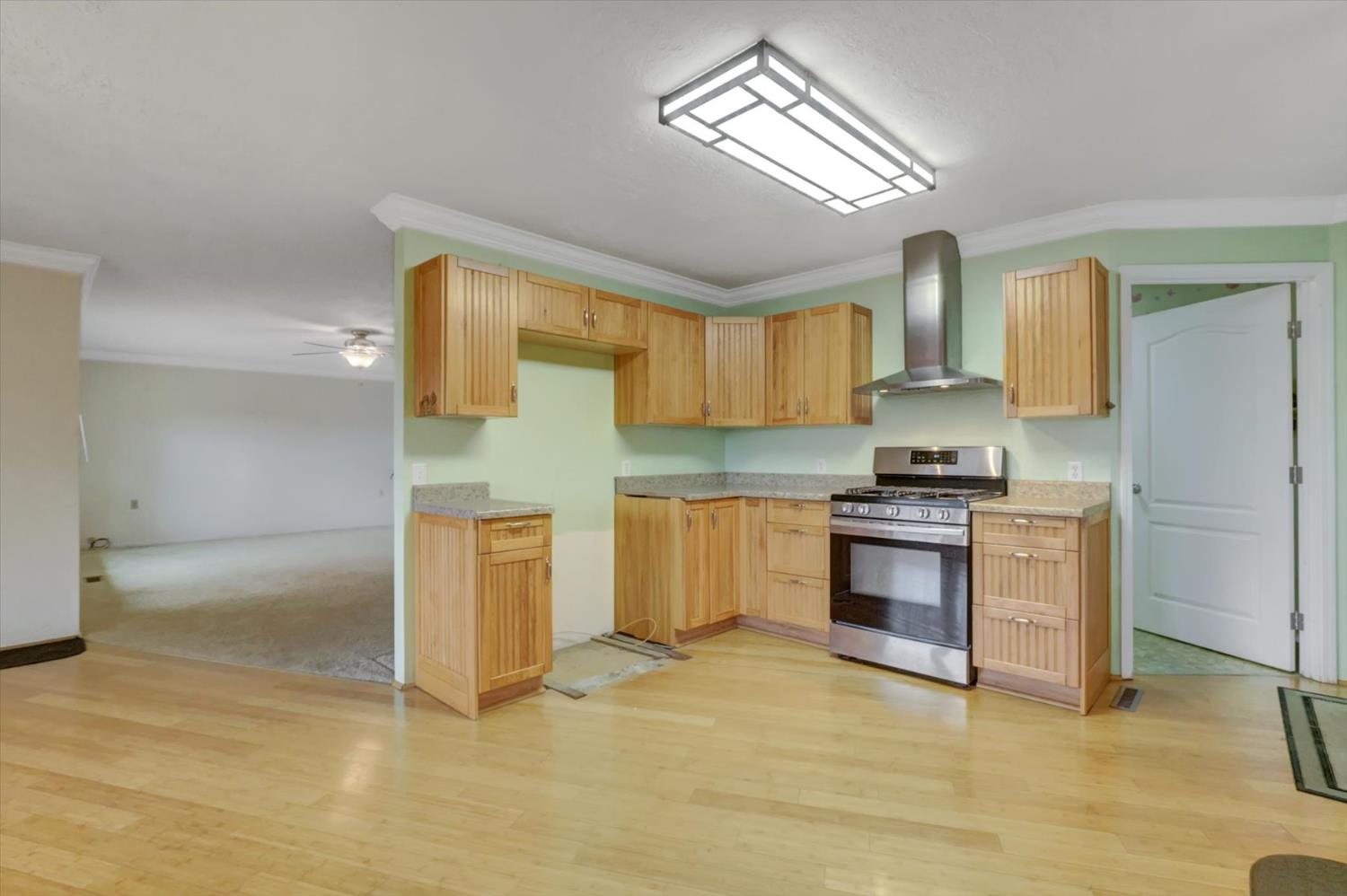 19121 Hiers Road Grass Valley, CA 95949 - Photo 7 of 94 a kitchen with granite countertop a stove a sink and a refrigerator