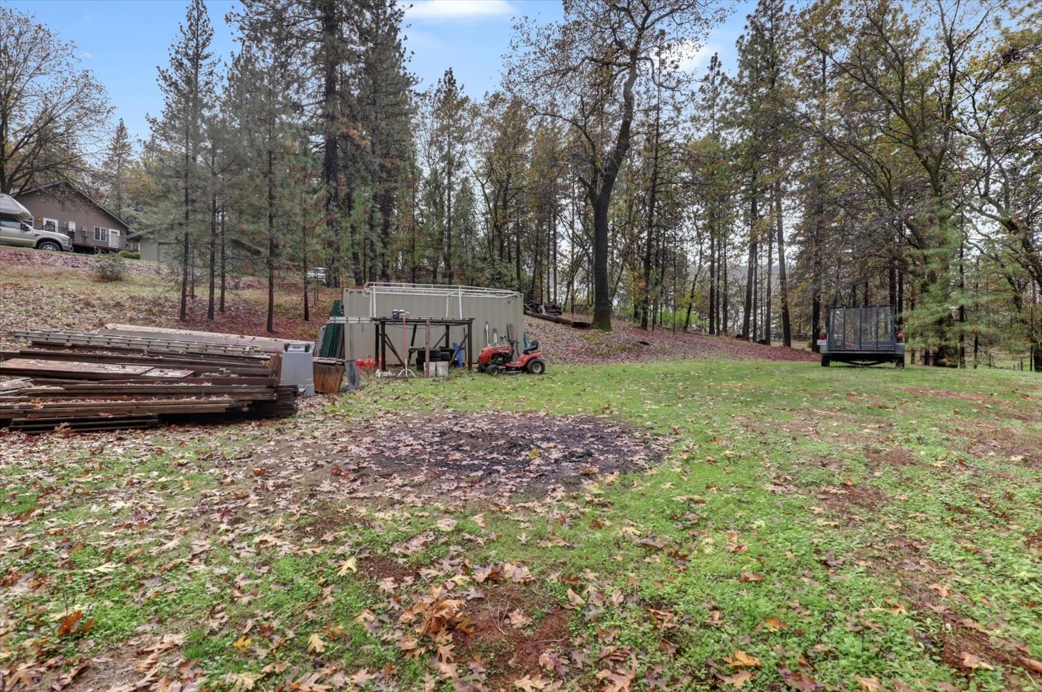 19121 Hiers Road Grass Valley, CA 95949 - Photo 80 of 94 a view of a house with backyard and trees