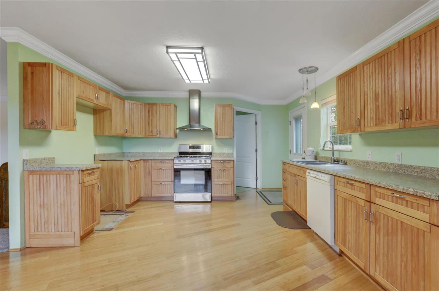 19121 Hiers Road Grass Valley, CA 95949 - Photo 8 of 94 a kitchen with stainless steel appliances a stove sink and cabinets
