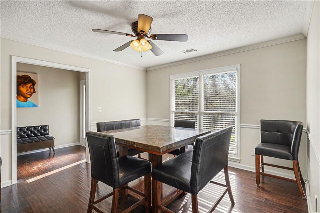 570 Morgan Court Hampton, GA 30228 - Photo 10 of 31 a view of a dining room with furniture window and wooden floor