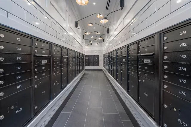 a living room with couches and a fireplace with wooden floor