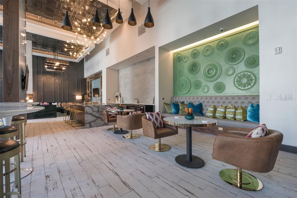 733 Main Lane, Unit 2 Orlando, FL 32801 - Photo 8 of 19 a living room with couches and a fireplace with wooden floor