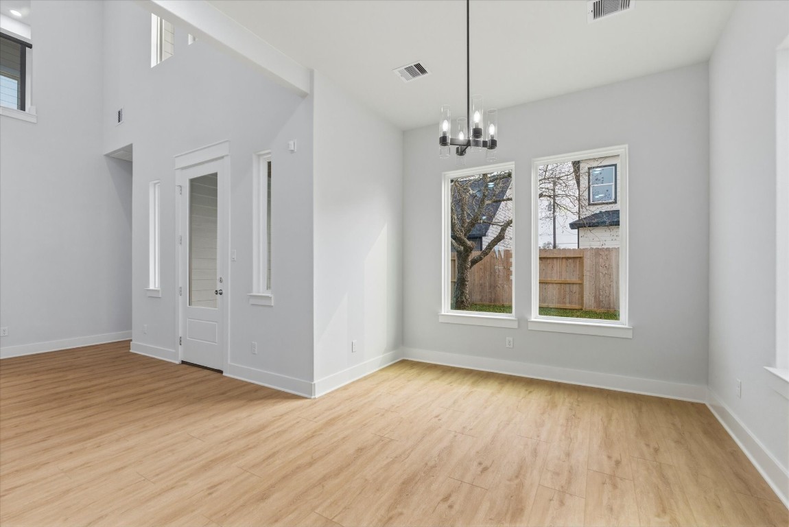 11626 Flintlock Road La Porte, TX 77571 - Photo 9 of 26 The spacious dining area is surrounded by large picture windows that fill the space with natural light.