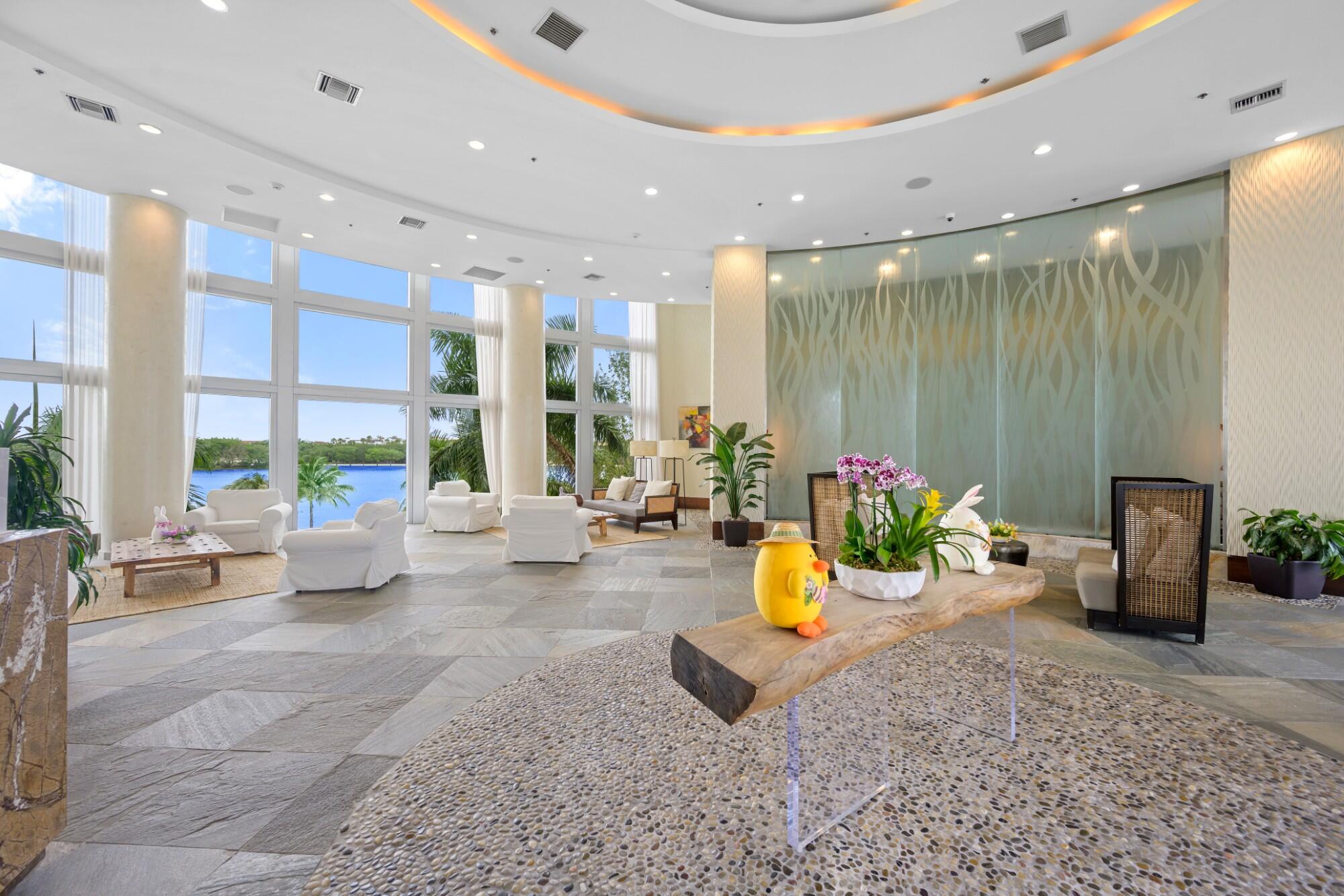 2641 North Flamingo Road, Unit 2108N Sunrise, FL 33323 - Photo 12 of 52 a view of a lobby with furniture and floor to ceiling window