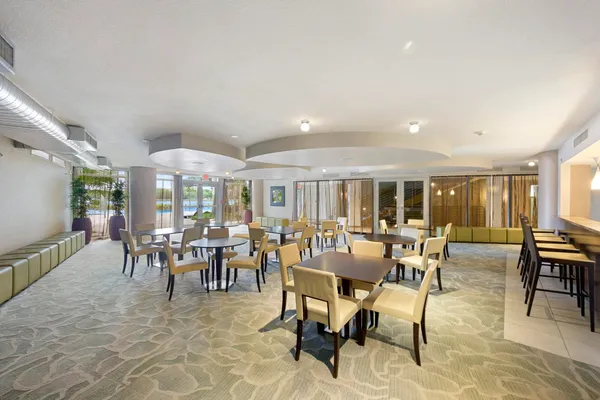 a view of a dining room with furniture window and outside view