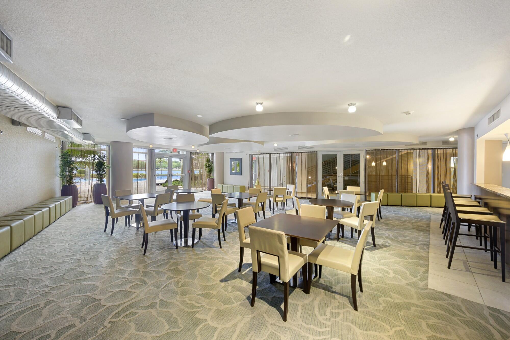 2641 North Flamingo Road, Unit 2108N Sunrise, FL 33323 - Photo 14 of 52 a view of a dining room with furniture window and outside view