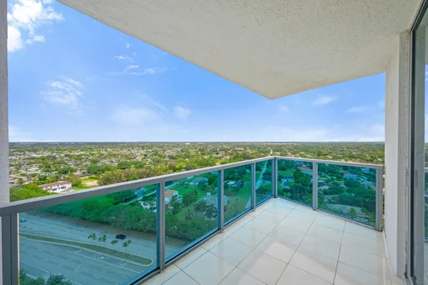 a view of balcony with yard