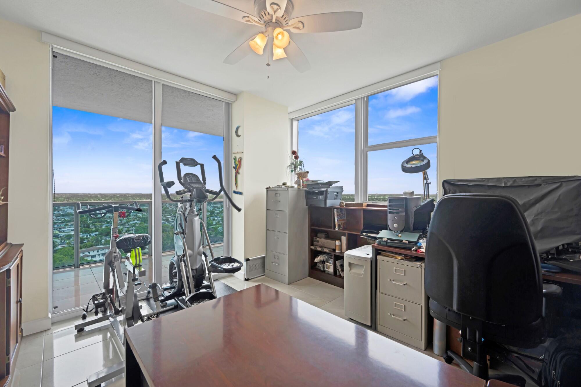 2641 North Flamingo Road, Unit 2108N Sunrise, FL 33323 - Photo 30 of 52 a view of a livingroom with workspace and a window