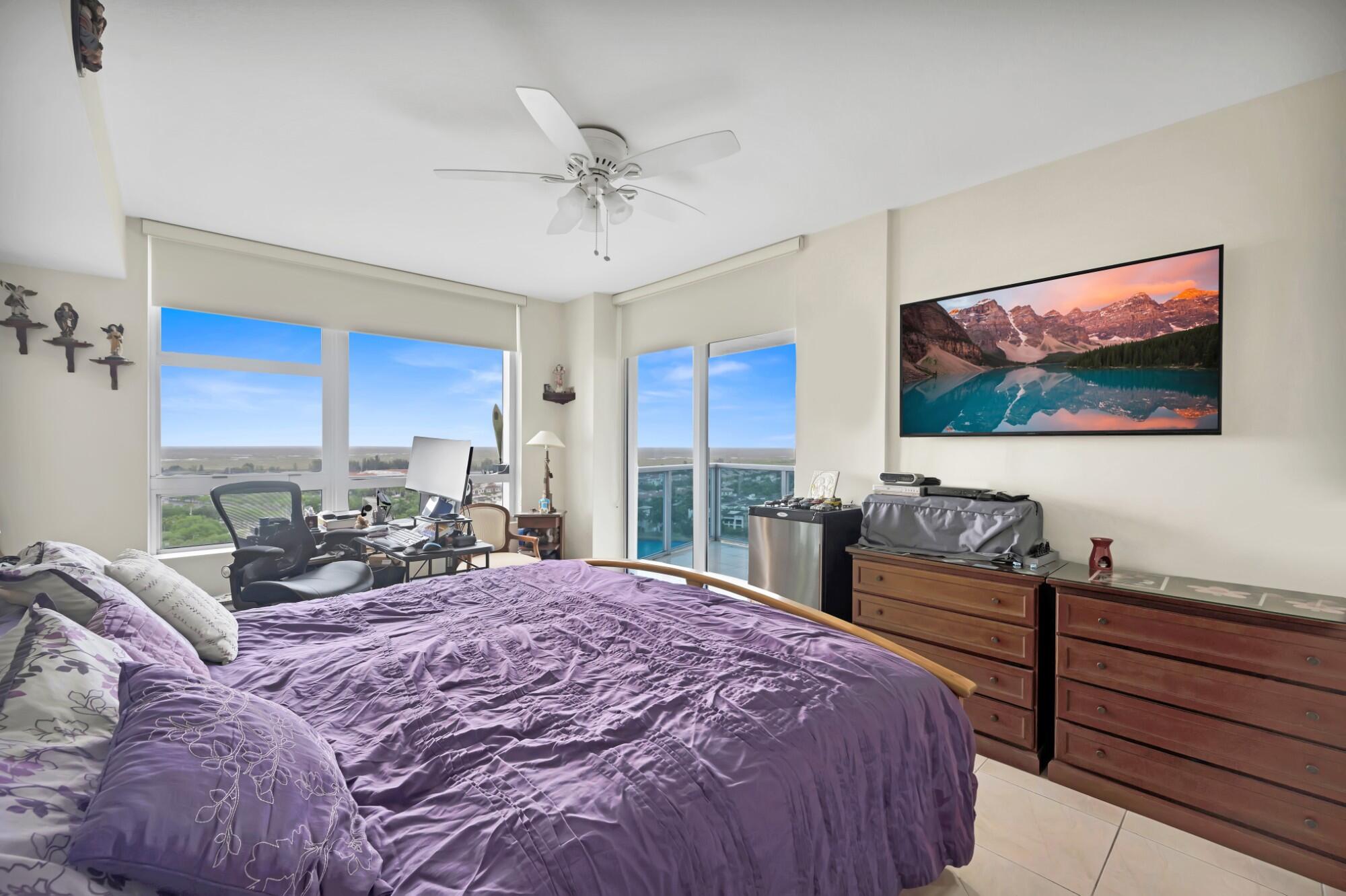 2641 North Flamingo Road, Unit 2108N Sunrise, FL 33323 - Photo 33 of 52 a bedroom with a bed and a flat screen tv