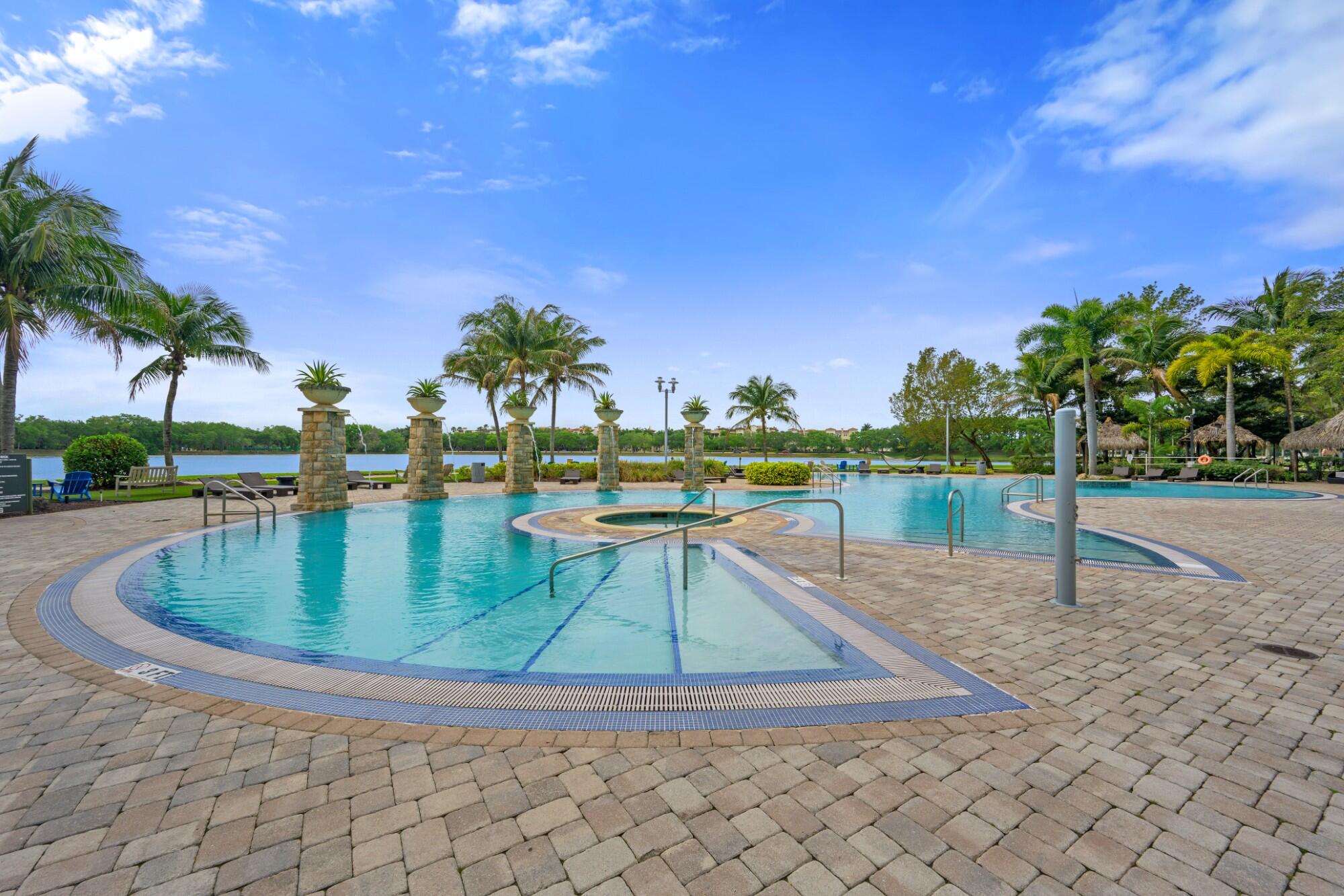 2641 North Flamingo Road, Unit 2108N Sunrise, FL 33323 - Photo 7 of 52 a view of a swimming pool with a lounge chairs