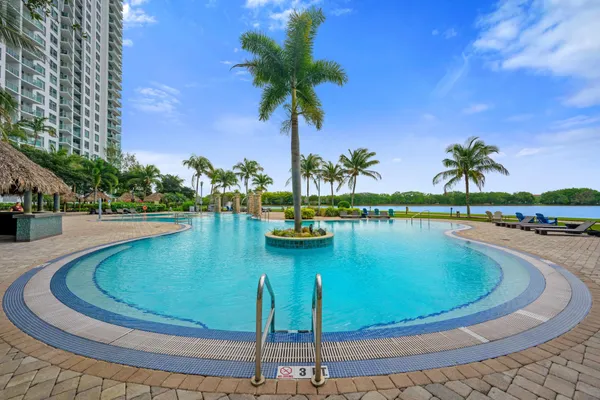 a view of a swimming pool with a table and chairs