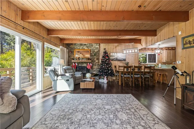 a living room with lots of furniture and a large window