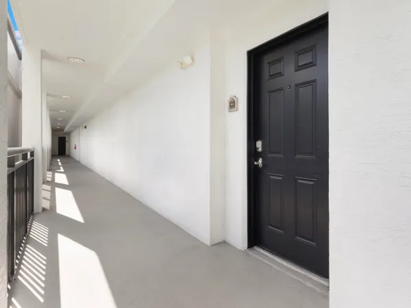 a view of a hallway with a white walls