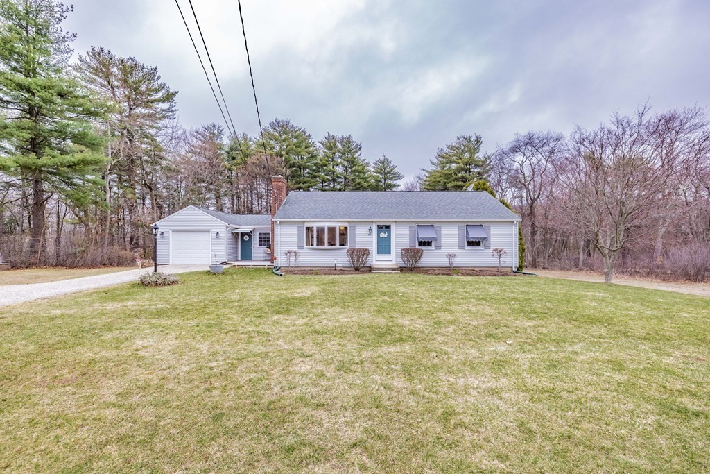 65 Mountain Road Holyoke, MA 01040 - Photo 2 of 35 a front view of house with yard and trees in the background
