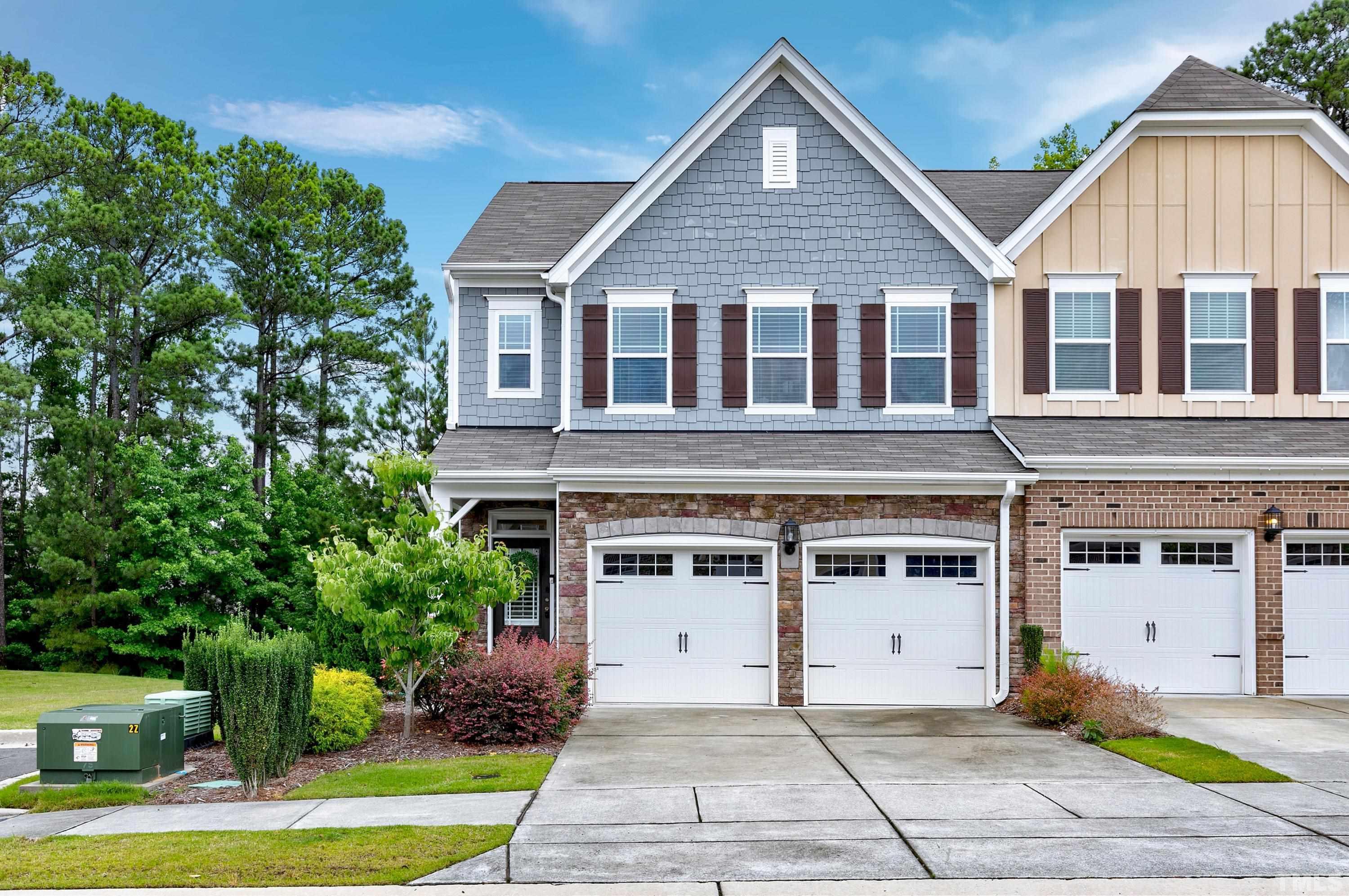 1161 Lookout Ridge Road Apex, NC 27502 - Photo 1 of 36 a front view of a house with a garden and trees