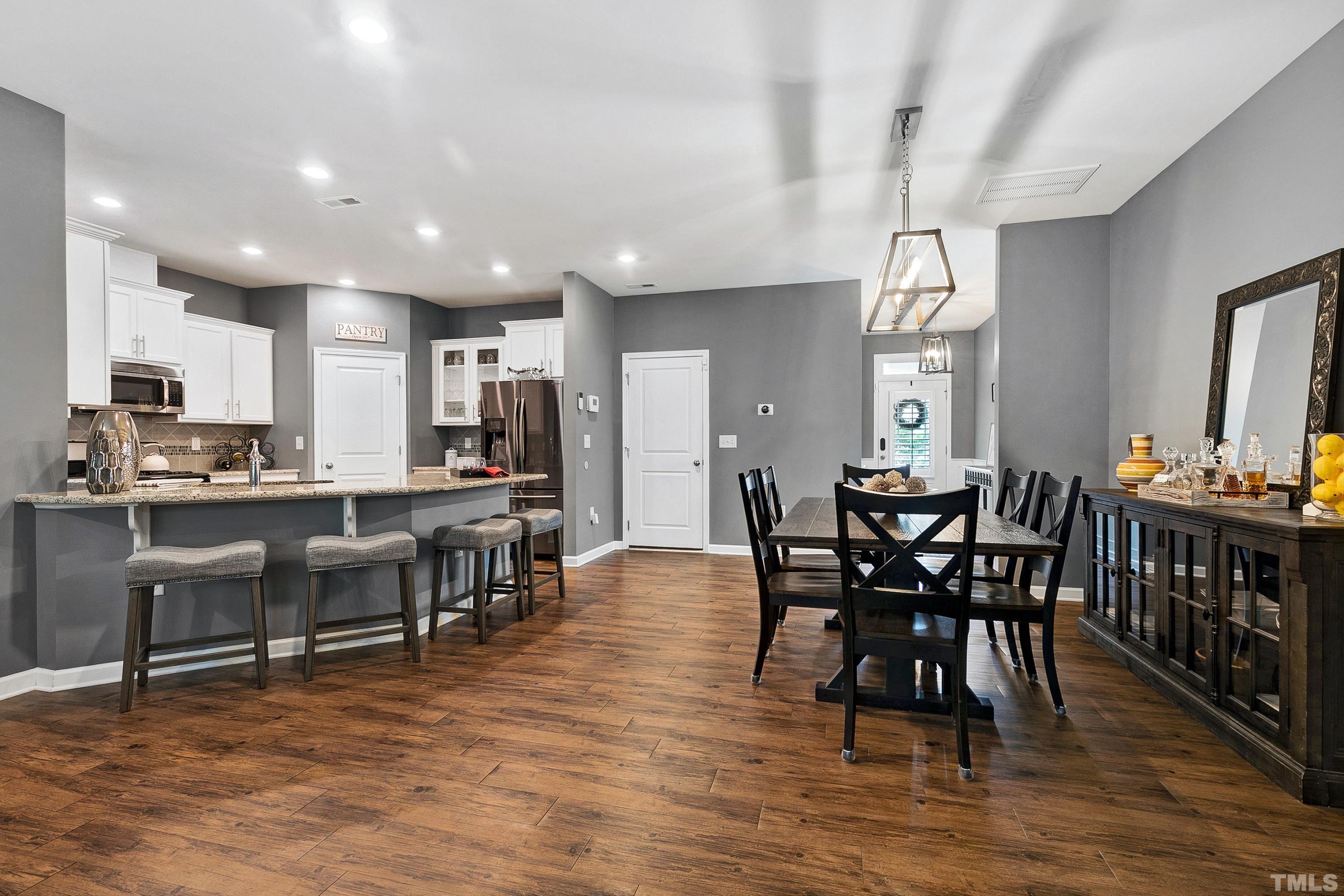 1161 Lookout Ridge Road Apex, NC 27502 - Photo 11 of 36 a view of a dining room with furniture