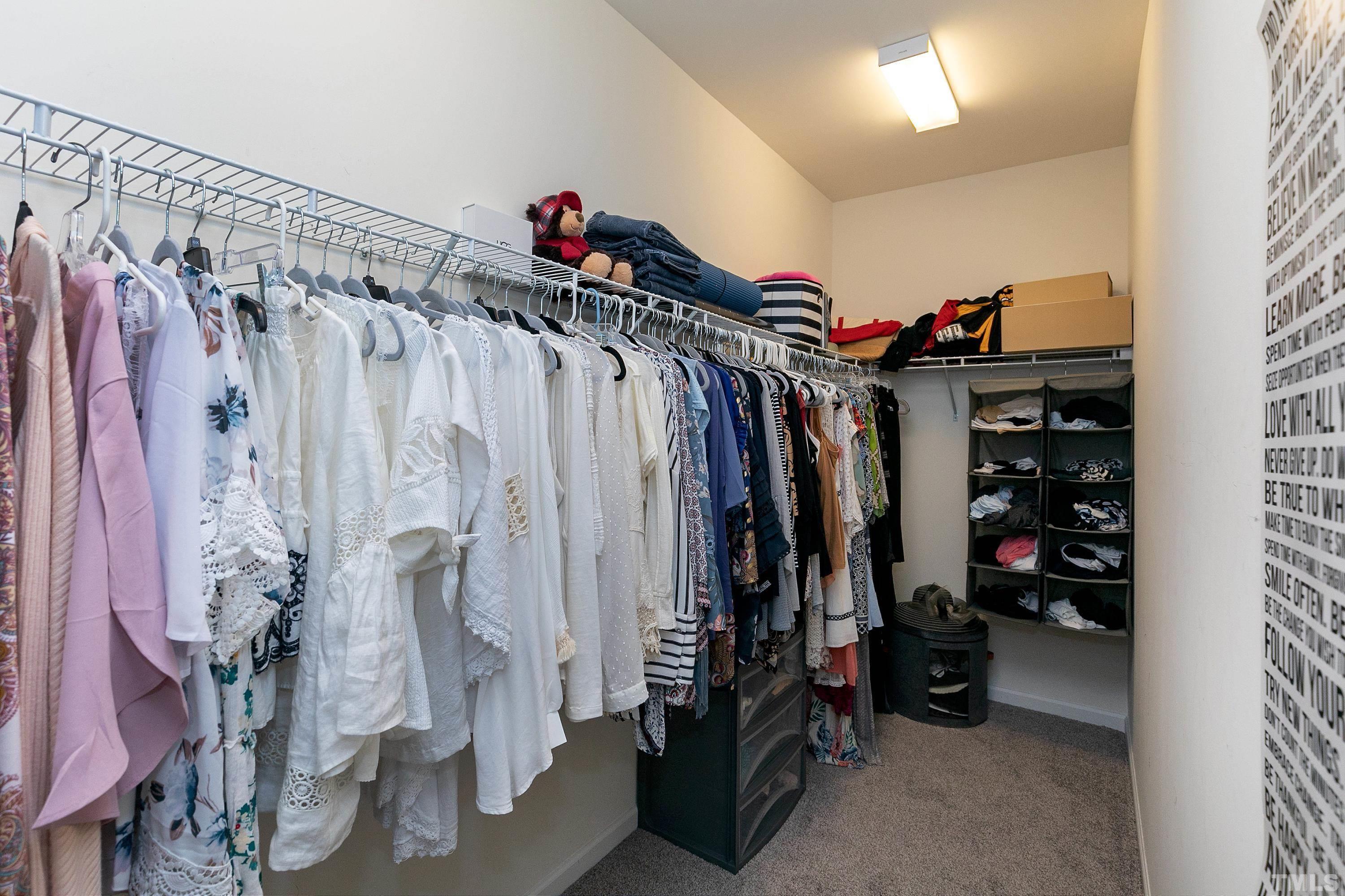 1161 Lookout Ridge Road Apex, NC 27502 - Photo 26 of 36 a view of walk in closet with clothes