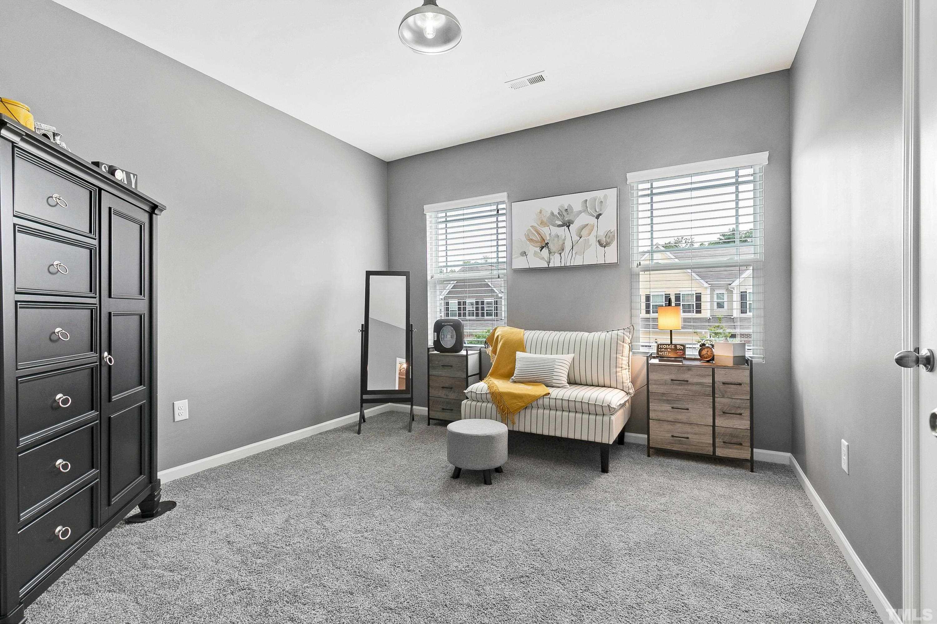 1161 Lookout Ridge Road Apex, NC 27502 - Photo 29 of 36 a bedroom with furniture and window