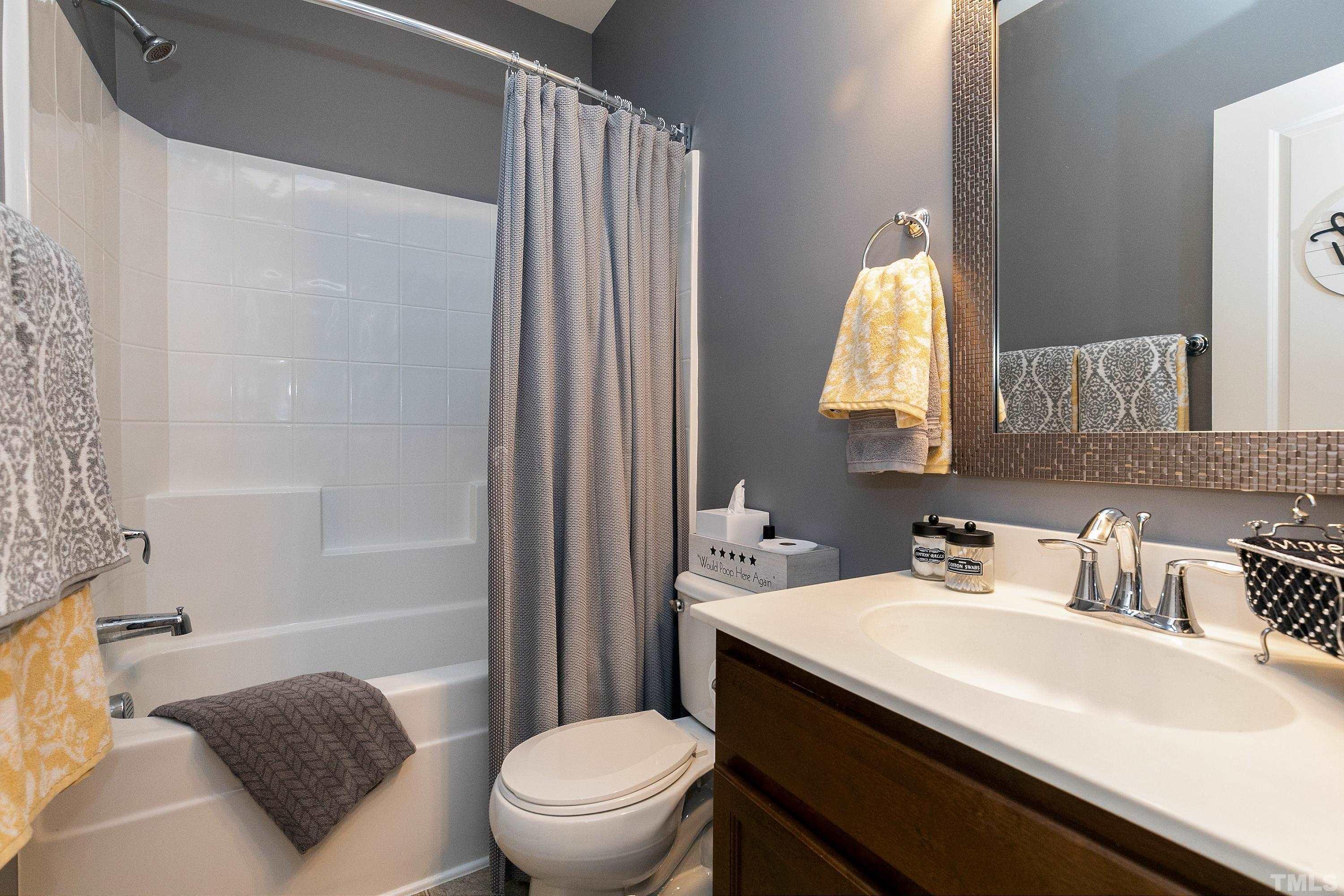 1161 Lookout Ridge Road Apex, NC 27502 - Photo 30 of 36 a bathroom with a sink toilet and shower