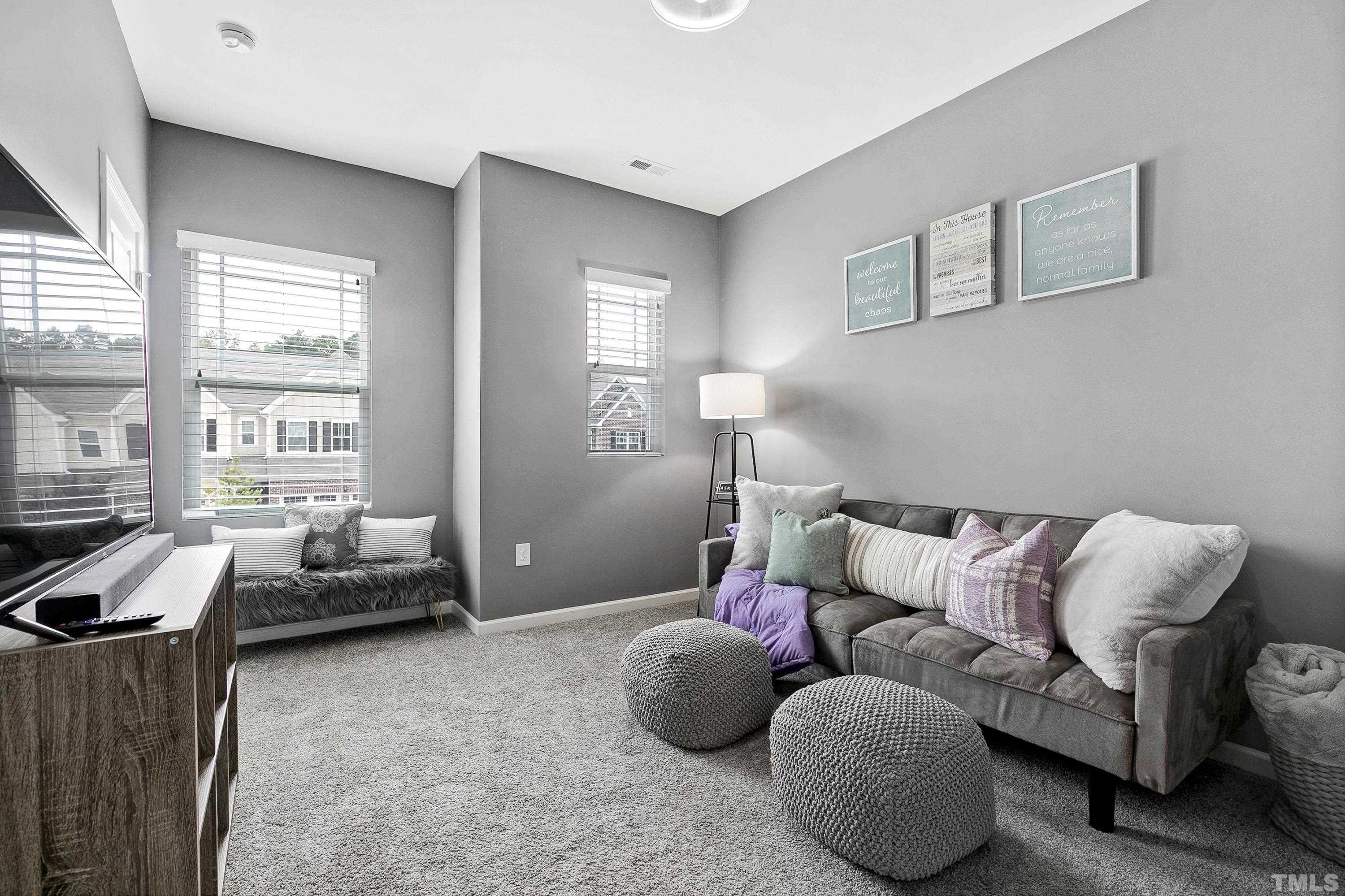 1161 Lookout Ridge Road Apex, NC 27502 - Photo 31 of 36 a bedroom with furniture and a large window