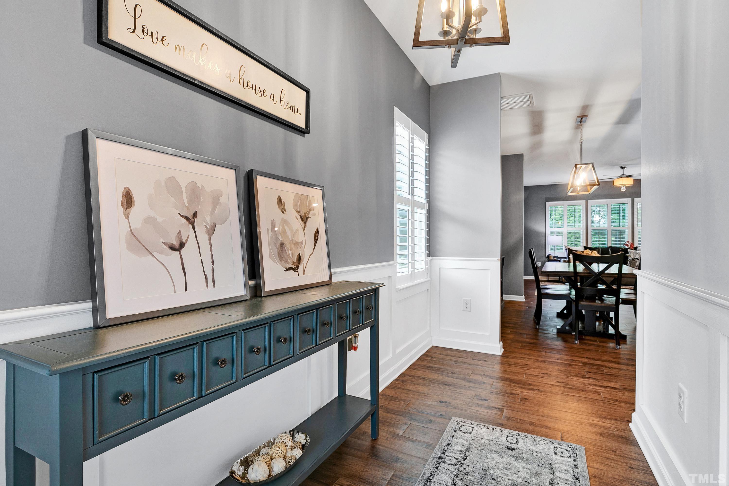 1161 Lookout Ridge Road Apex, NC 27502 - Photo 4 of 36 a hallway with furniture and wooden floor