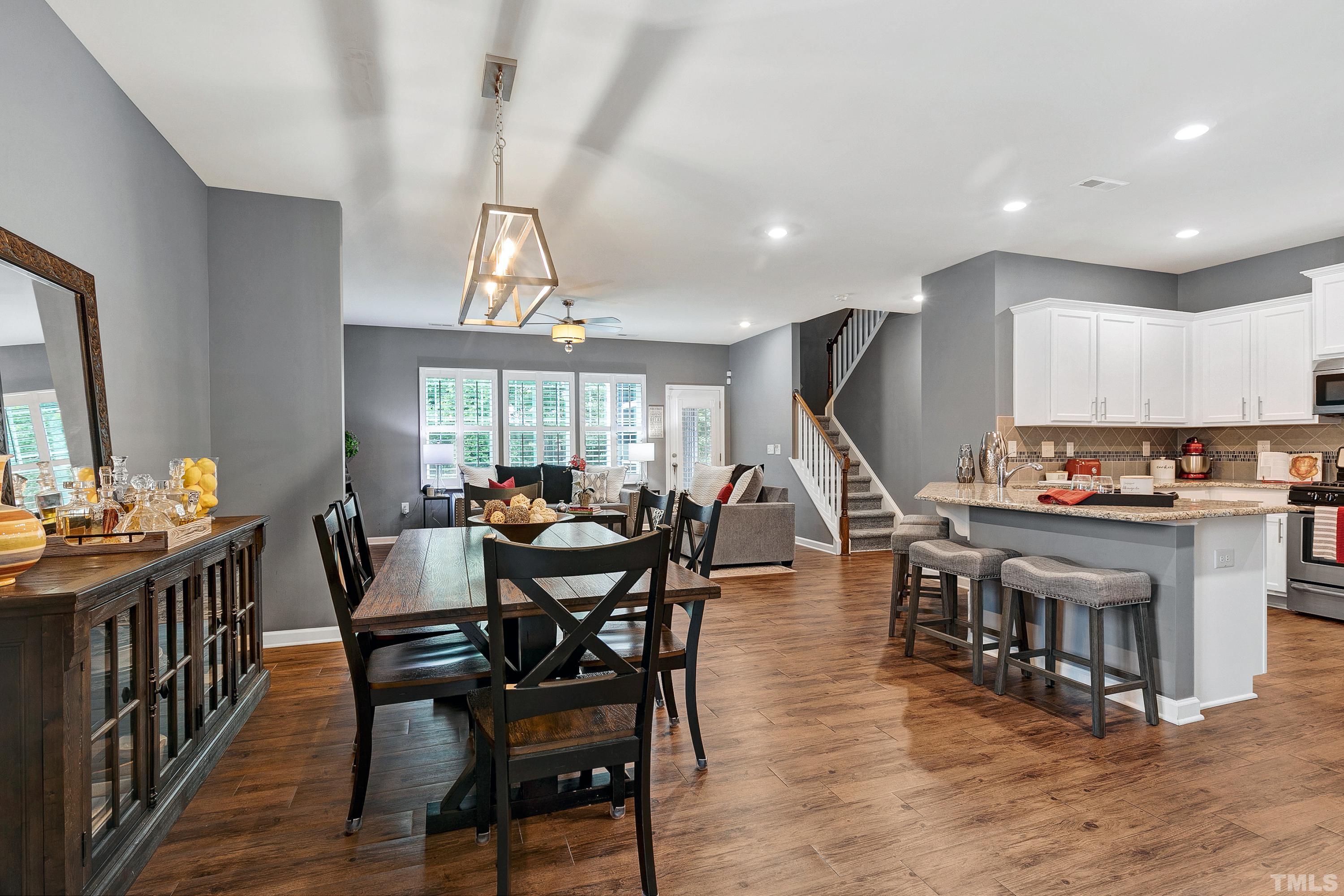 1161 Lookout Ridge Road Apex, NC 27502 - Photo 6 of 36 a view of a dining room with furniture window and wooden floor
