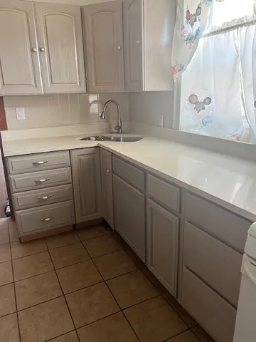 a kitchen with appliances cabinets and a sink