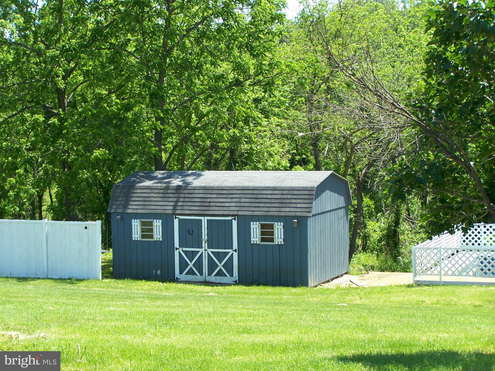 3399 Lineboro Road Manchester, MD 21102 - Photo 22 of 28 a view of a house with a yard
