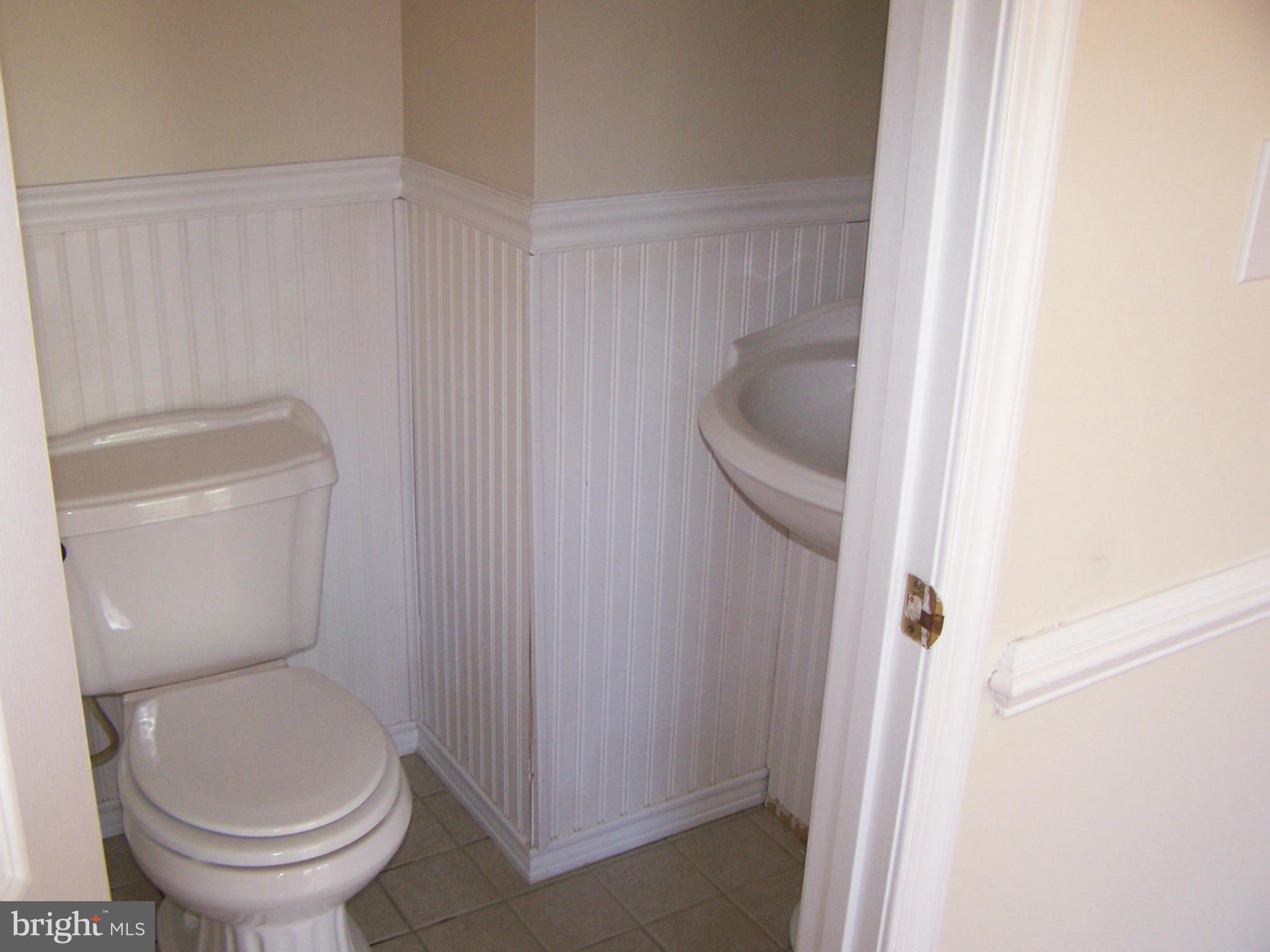 3399 Lineboro Road Manchester, MD 21102 - Photo 8 of 28 a white toilet sitting next to a shower