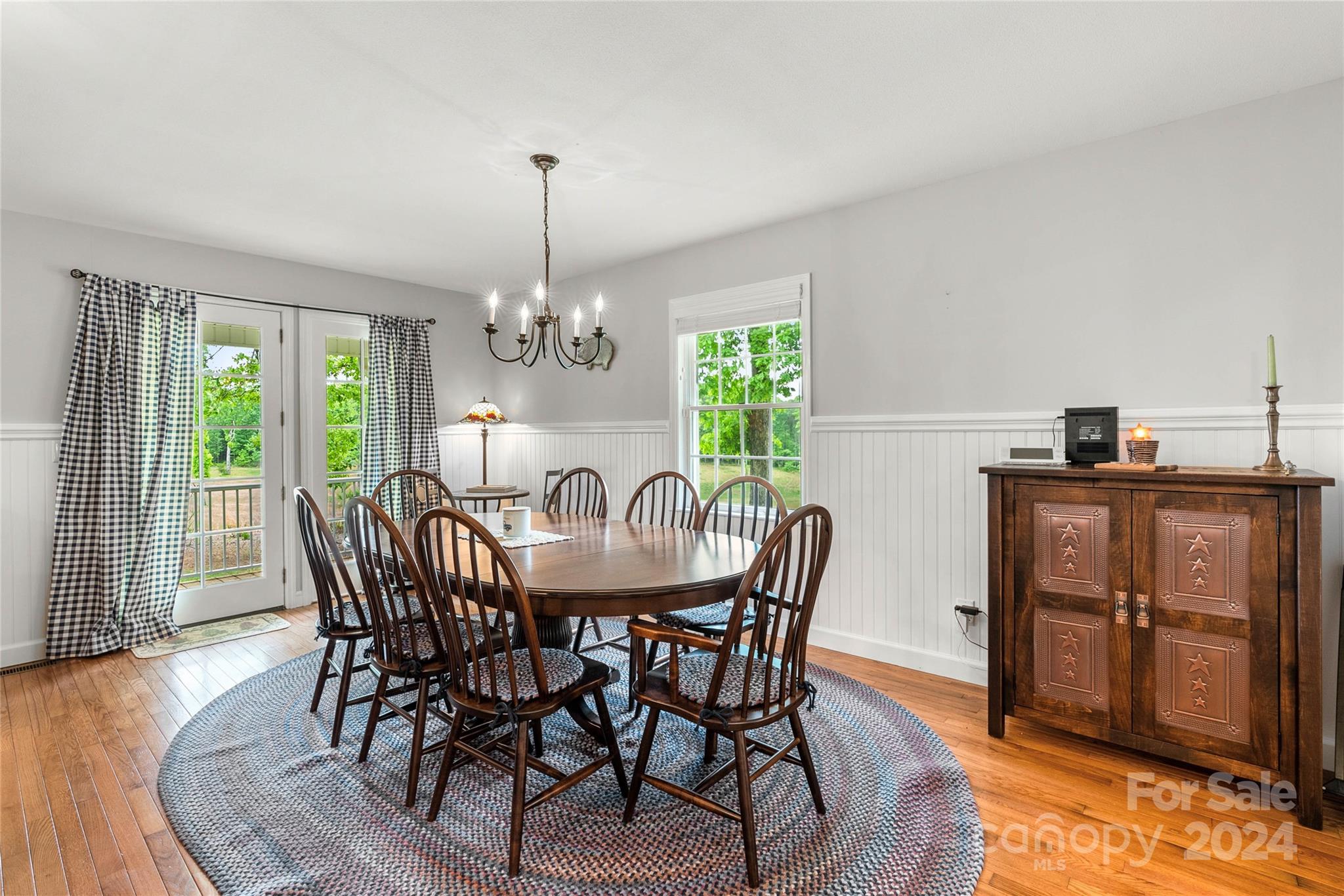 1154 Landrum Road Columbus, NC 28722 - Photo 15 of 36 a view of a dining room with furniture window and wooden floor
