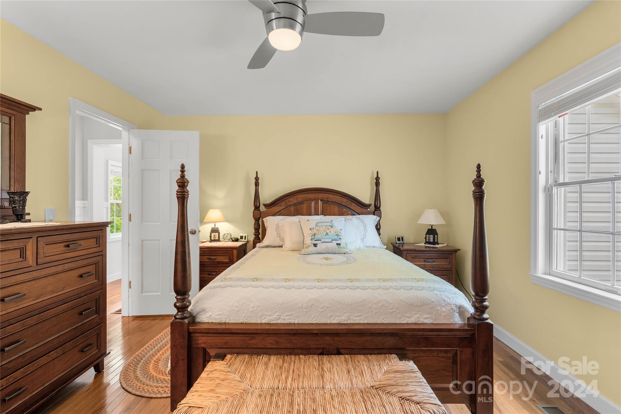 1154 Landrum Road Columbus, NC 28722 - Photo 17 of 36 a bedroom with a bed and wooden floor
