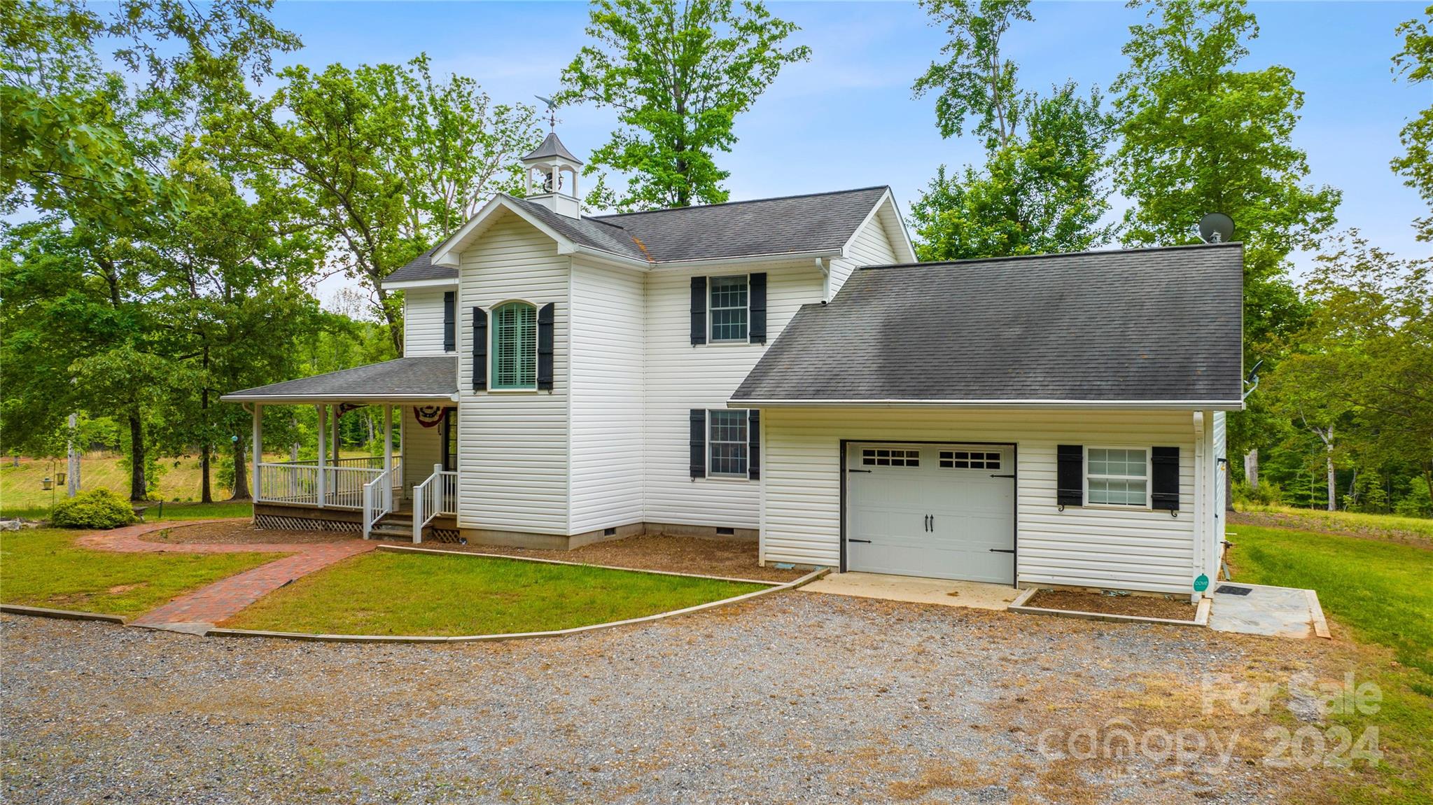 1154 Landrum Road Columbus, NC 28722 - Photo 2 of 36 a view of a house with a yard and potted plants