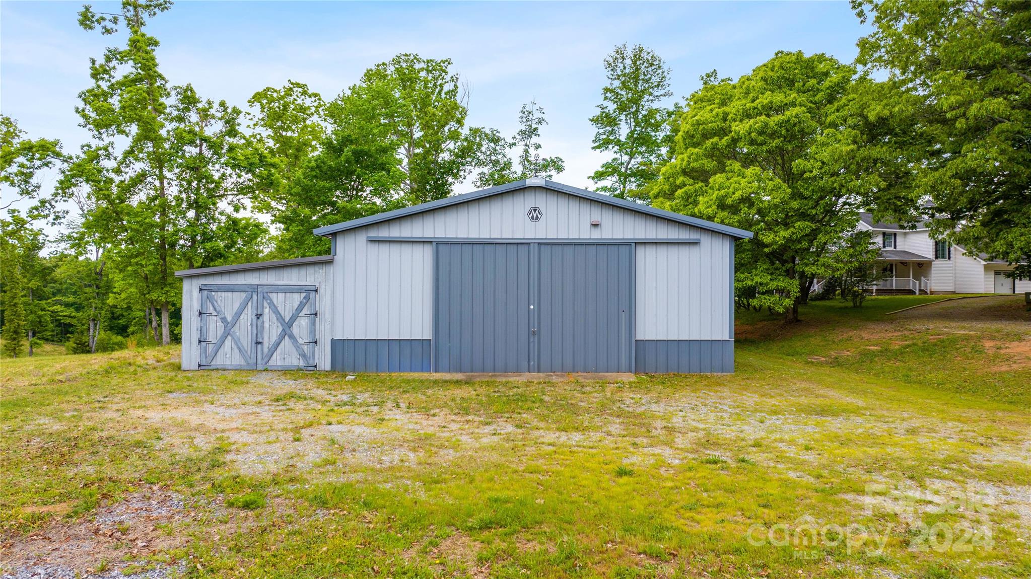 1154 Landrum Road Columbus, NC 28722 - Photo 27 of 36 a view of a house with a yard