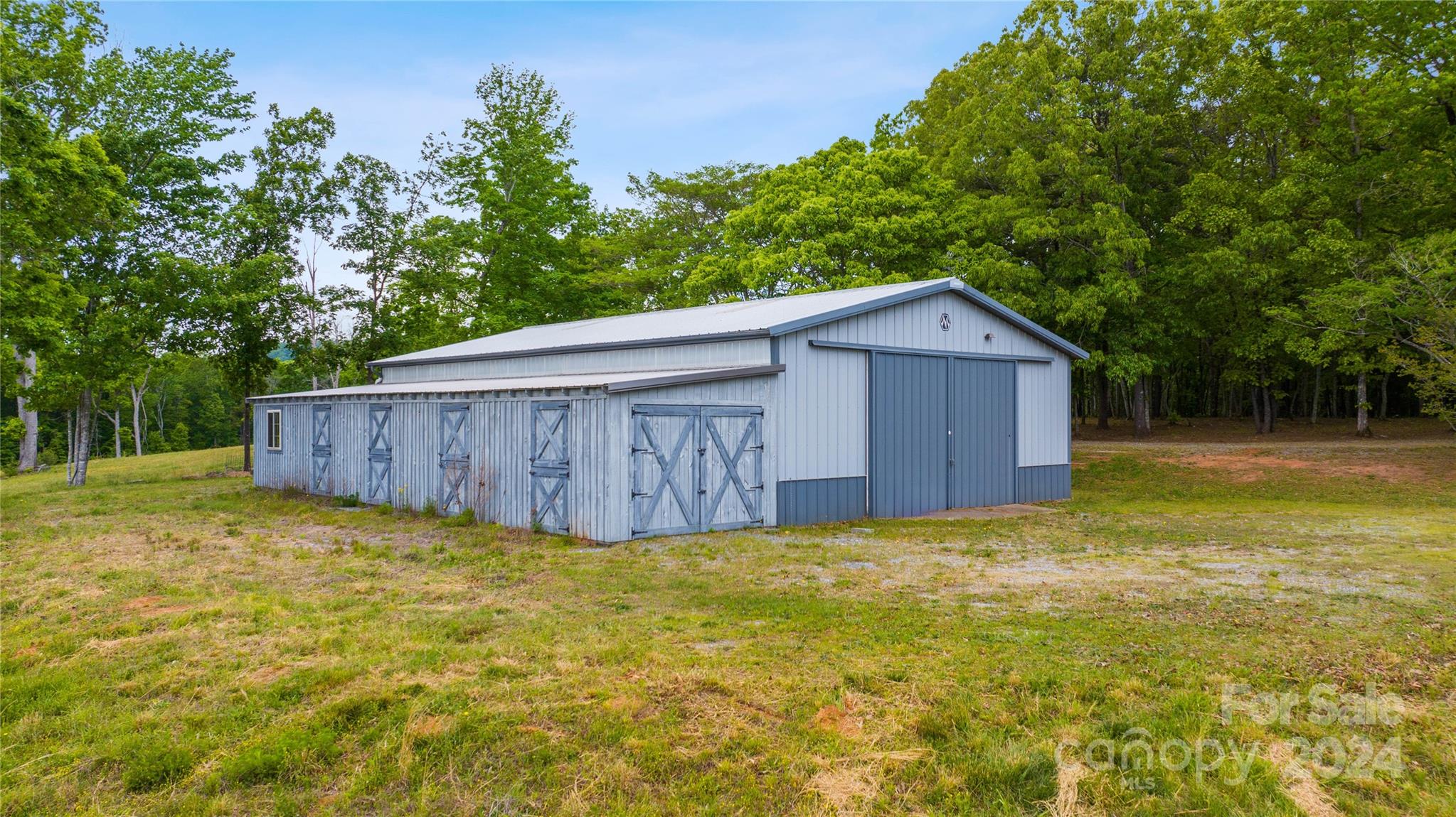 1154 Landrum Road Columbus, NC 28722 - Photo 28 of 36 a view of a house with a backyard