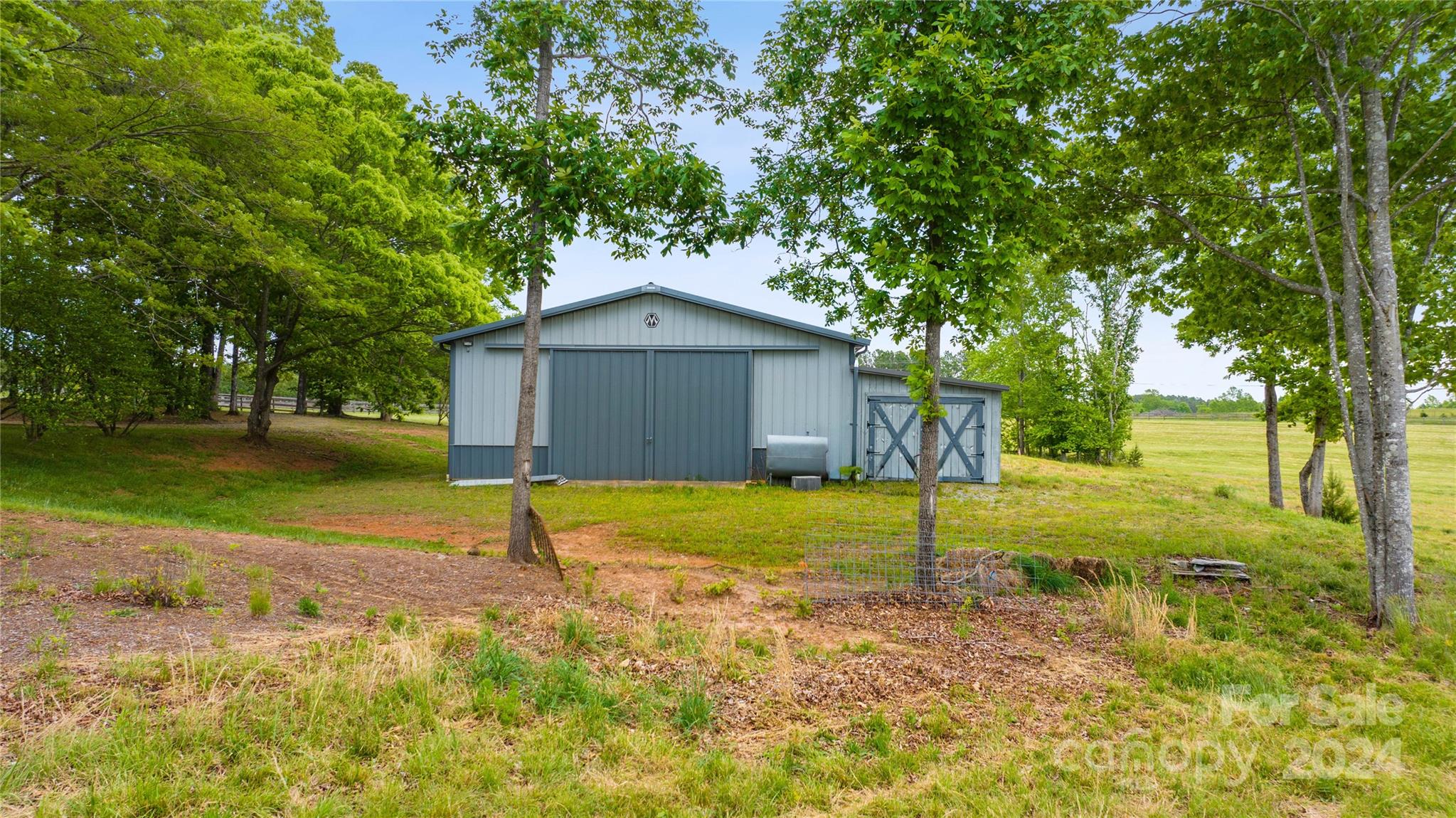 1154 Landrum Road Columbus, NC 28722 - Photo 30 of 36 a house view with a garden space