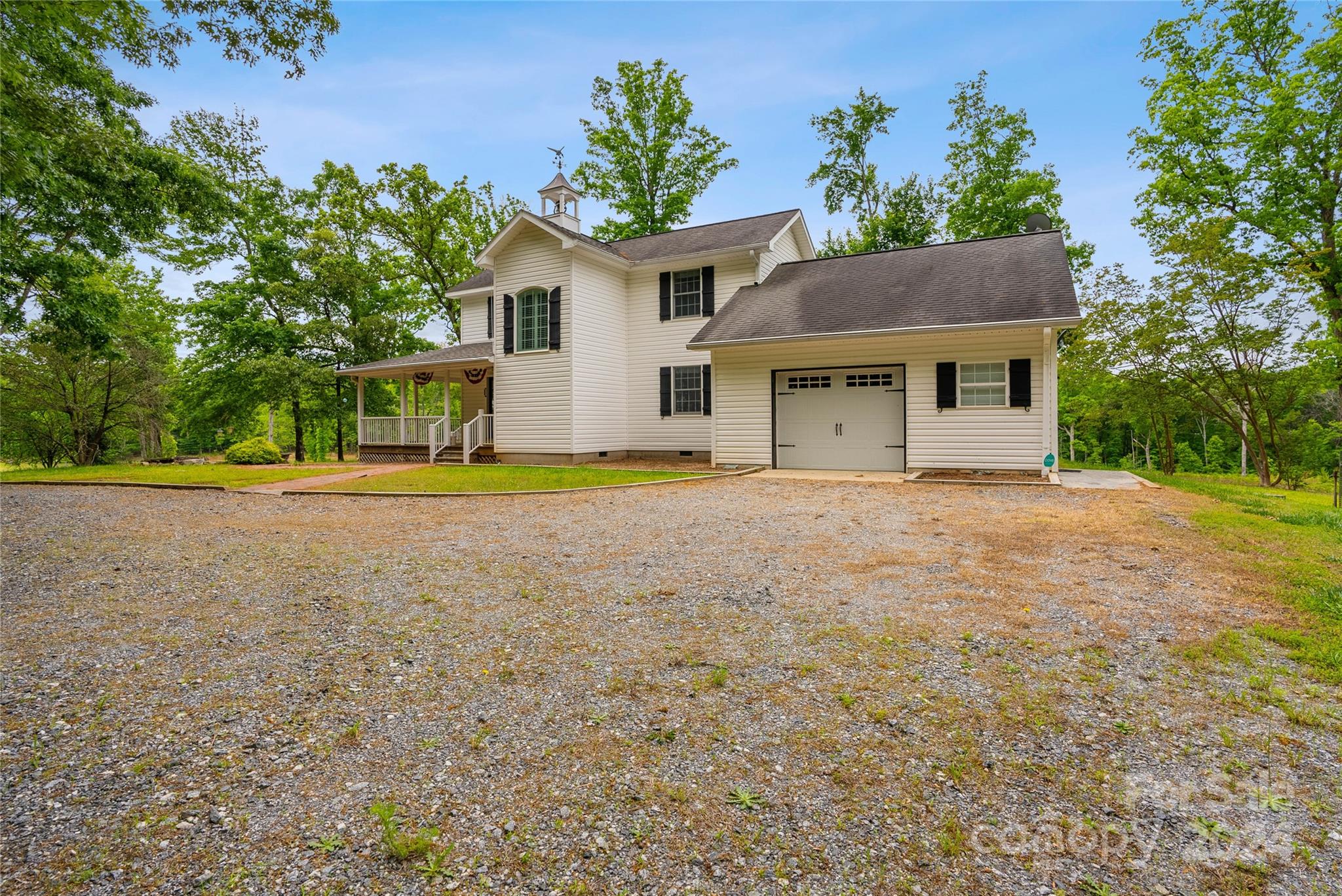1154 Landrum Road Columbus, NC 28722 - Photo 3 of 36 a front view of a house with a yard and trees