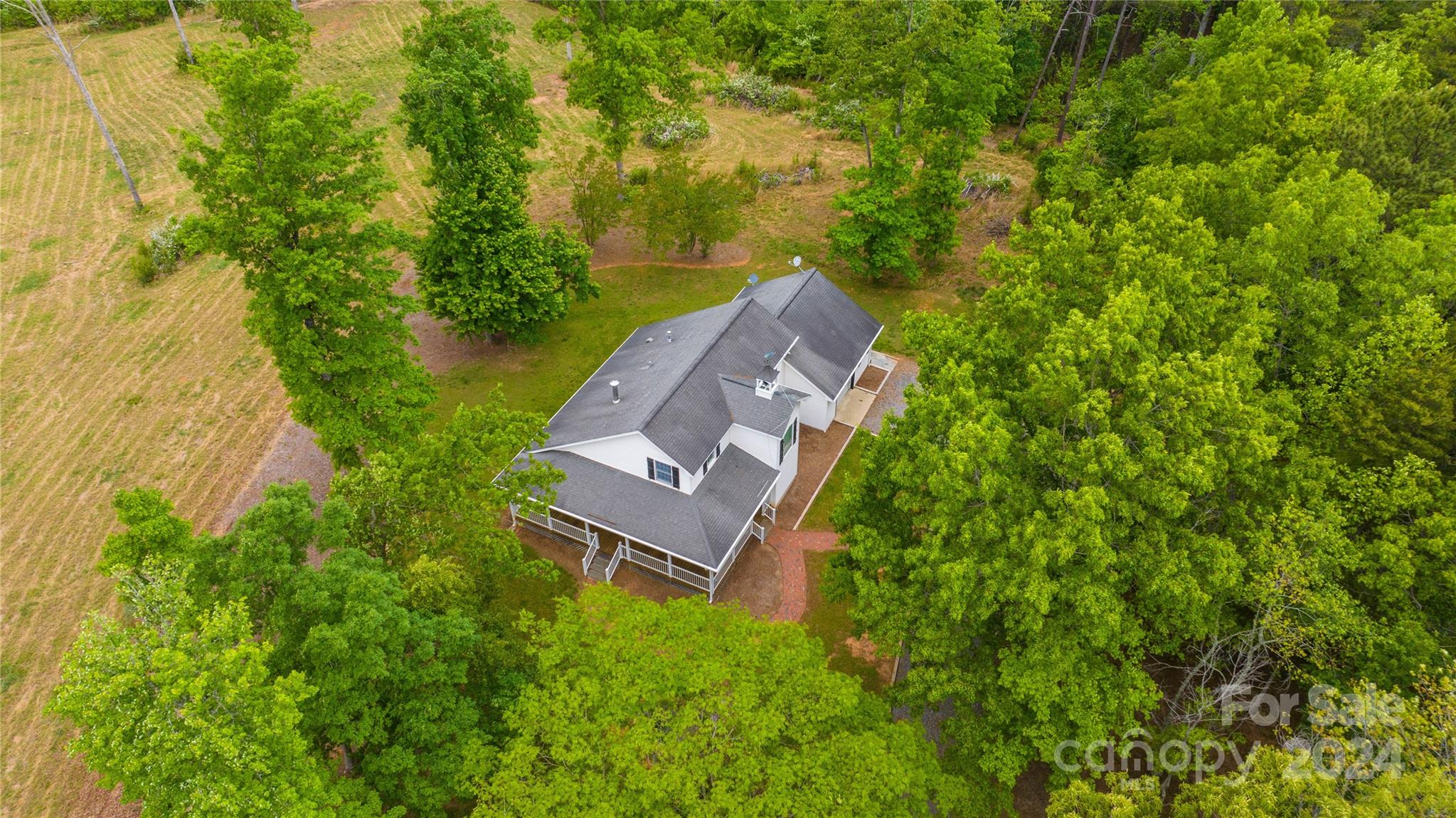 1154 Landrum Road Columbus, NC 28722 - Photo 34 of 36 a view of a house with a yard