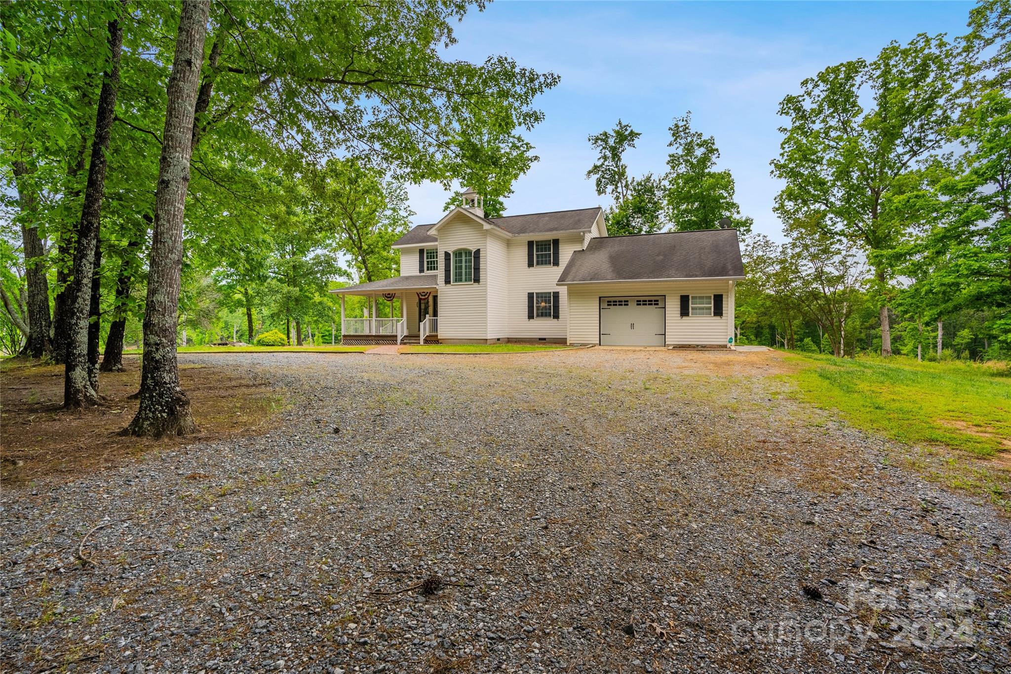 1154 Landrum Road Columbus, NC 28722 - Photo 4 of 36 a house with trees in the background