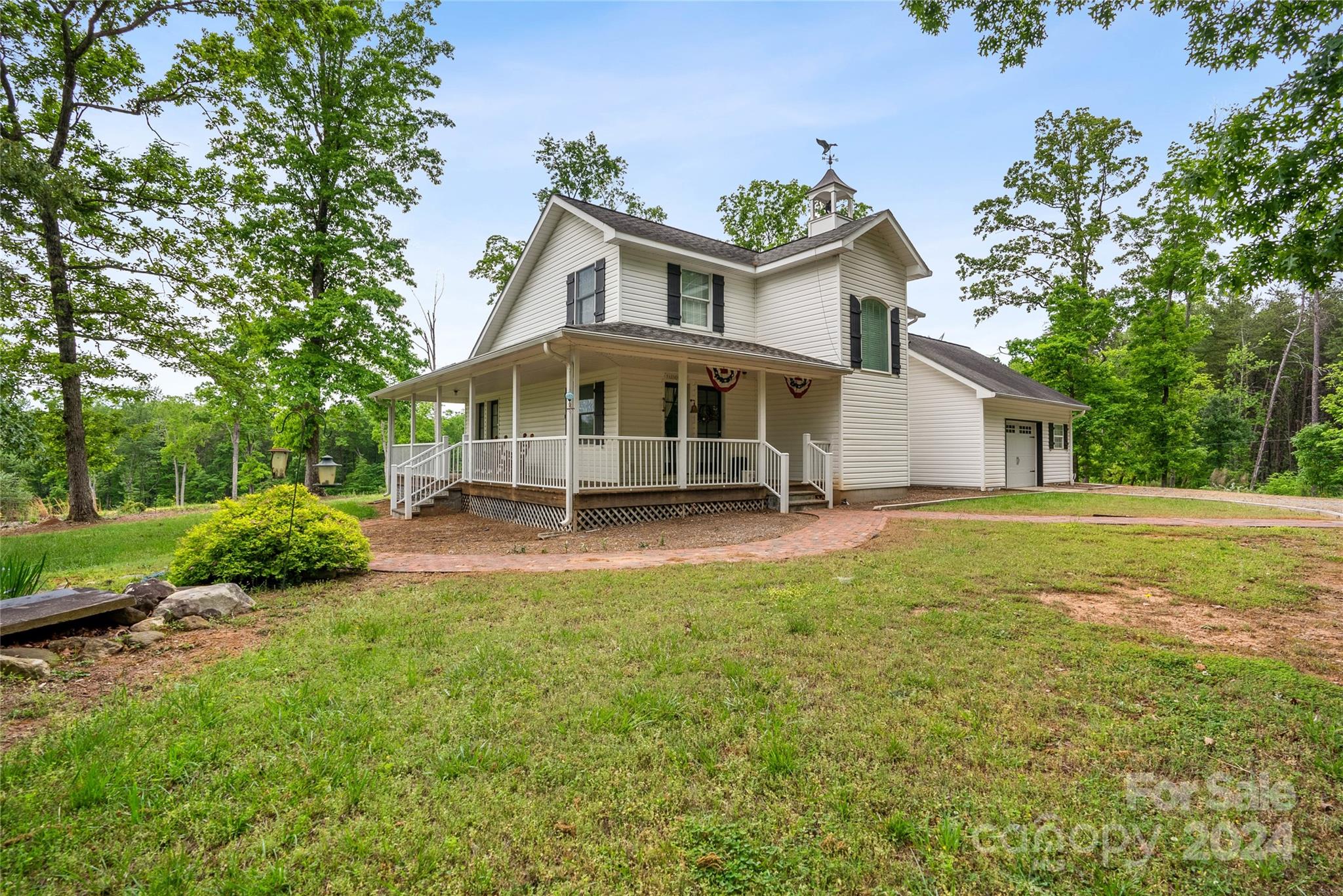 1154 Landrum Road Columbus, NC 28722 - Photo 7 of 36 a view of a house with backyard porch and garden