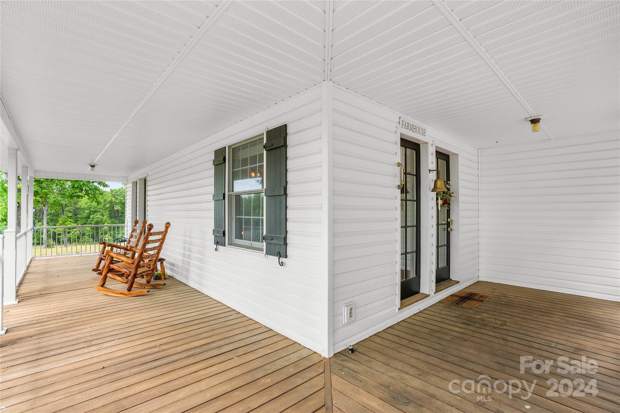 1154 Landrum Road Columbus, NC 28722 - Photo 8 of 36 a view of a two chairs in wooden deck