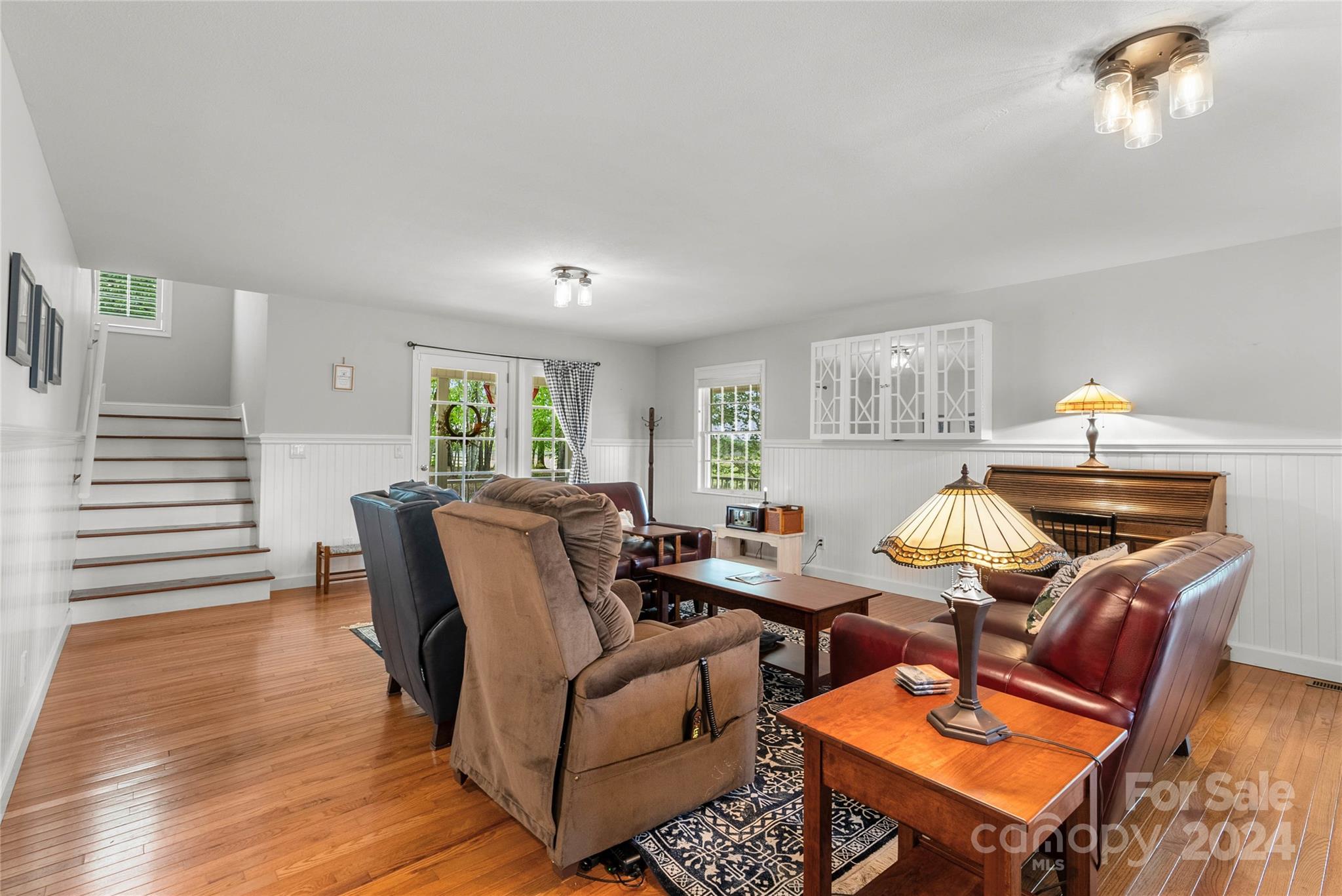 1154 Landrum Road Columbus, NC 28722 - Photo 10 of 36 a living room with furniture a lamp and a window