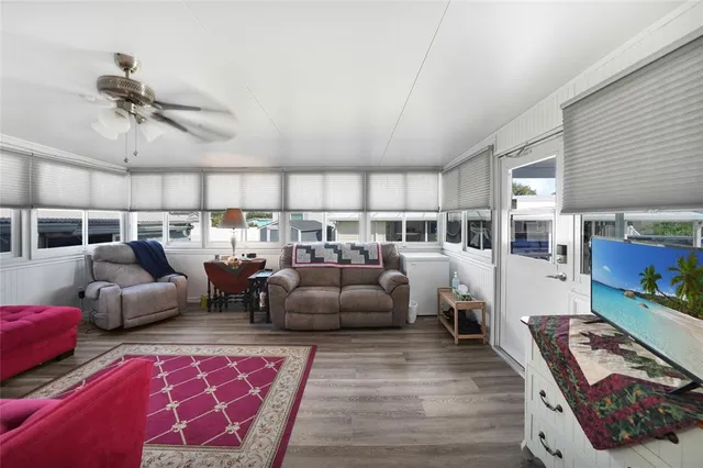 a living room with furniture and a rug