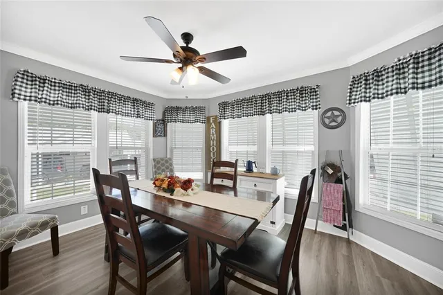 a dining room with furniture and window