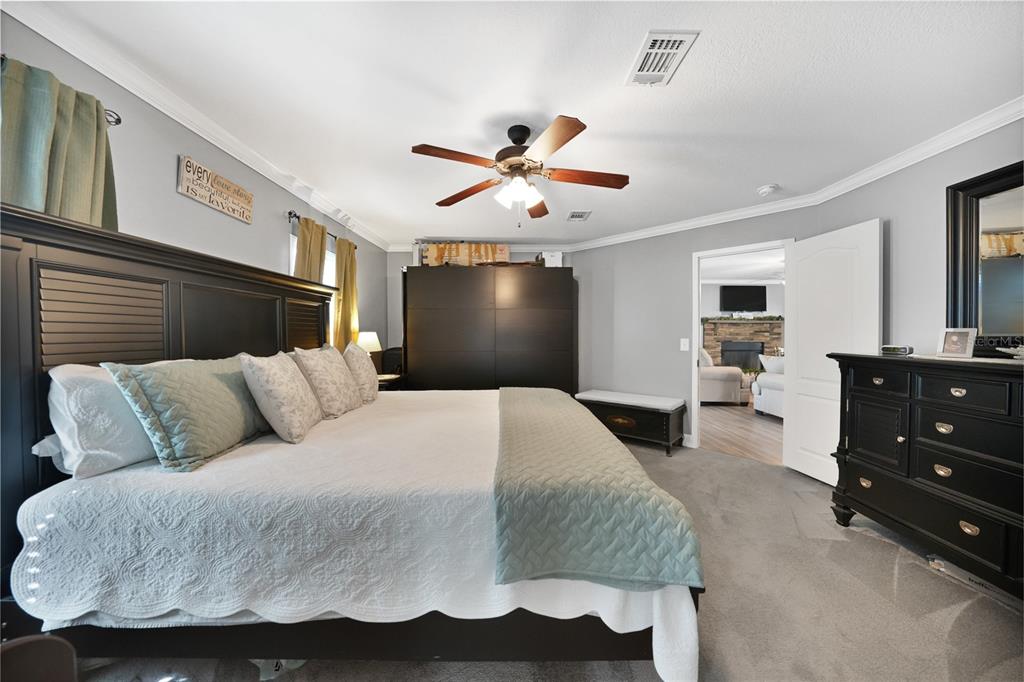 14 North Cardinal, Unit B14 Punta Gorda, FL 33950 - Photo 19 of 40 a bedroom with a bed and wooden floor