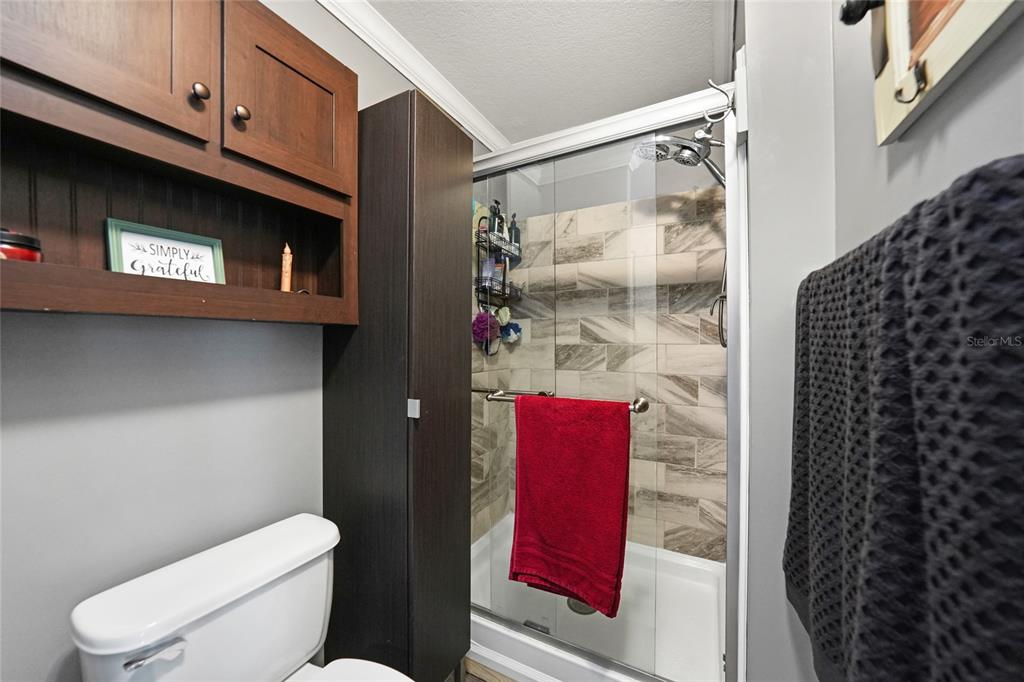 14 North Cardinal, Unit B14 Punta Gorda, FL 33950 - Photo 23 of 40 a bathroom with a toilet and a shower curtain