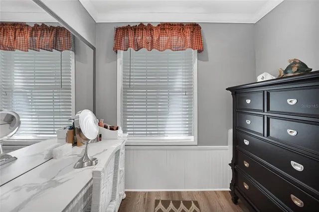 a bathroom with a sink and a window