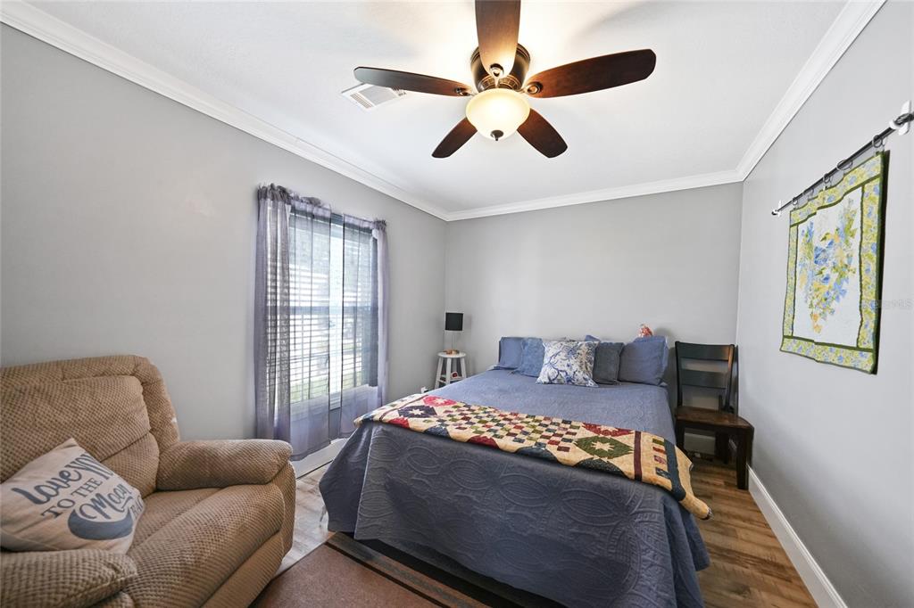 14 North Cardinal, Unit B14 Punta Gorda, FL 33950 - Photo 26 of 40 a bedroom with a bed couch and window