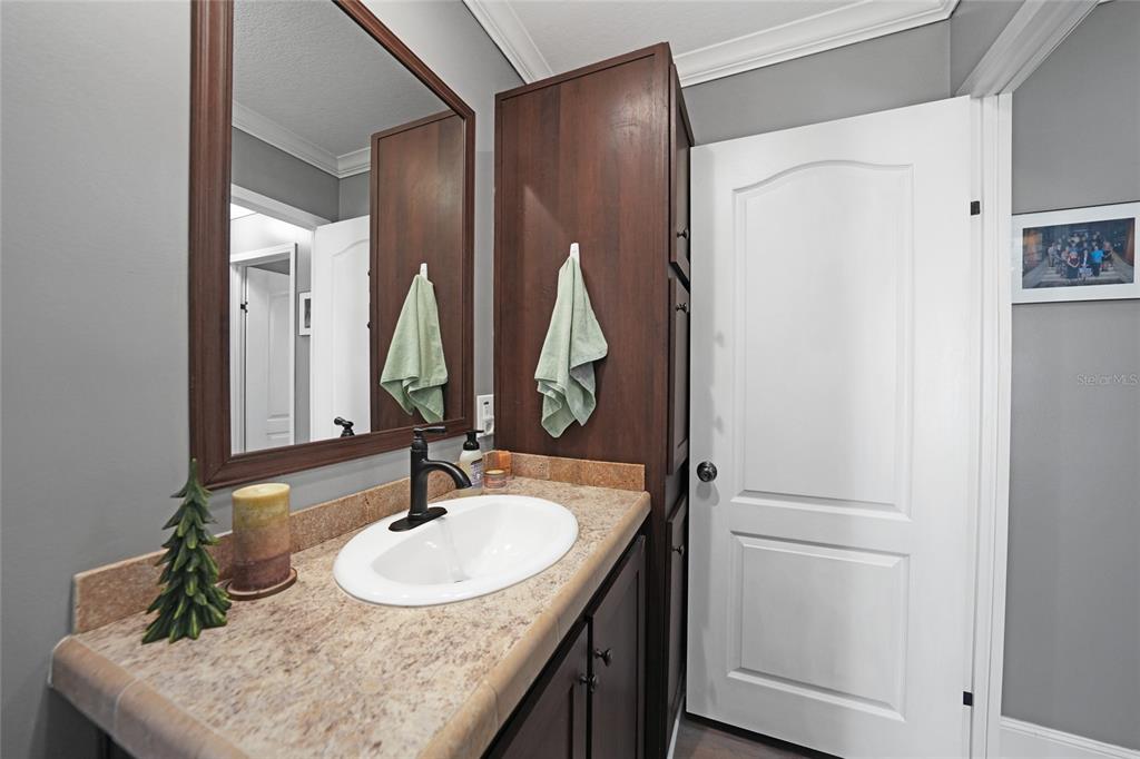 14 North Cardinal, Unit B14 Punta Gorda, FL 33950 - Photo 29 of 40 a bathroom with a sink and a mirror