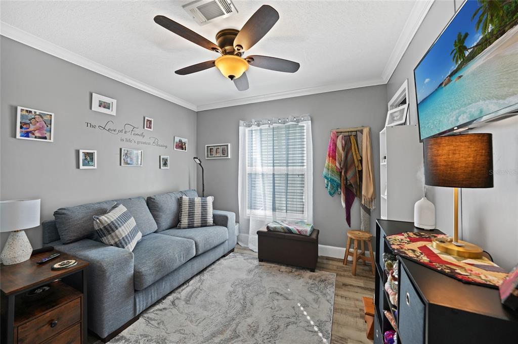 14 North Cardinal, Unit B14 Punta Gorda, FL 33950 - Photo 30 of 40 a living room with furniture and a flat screen tv